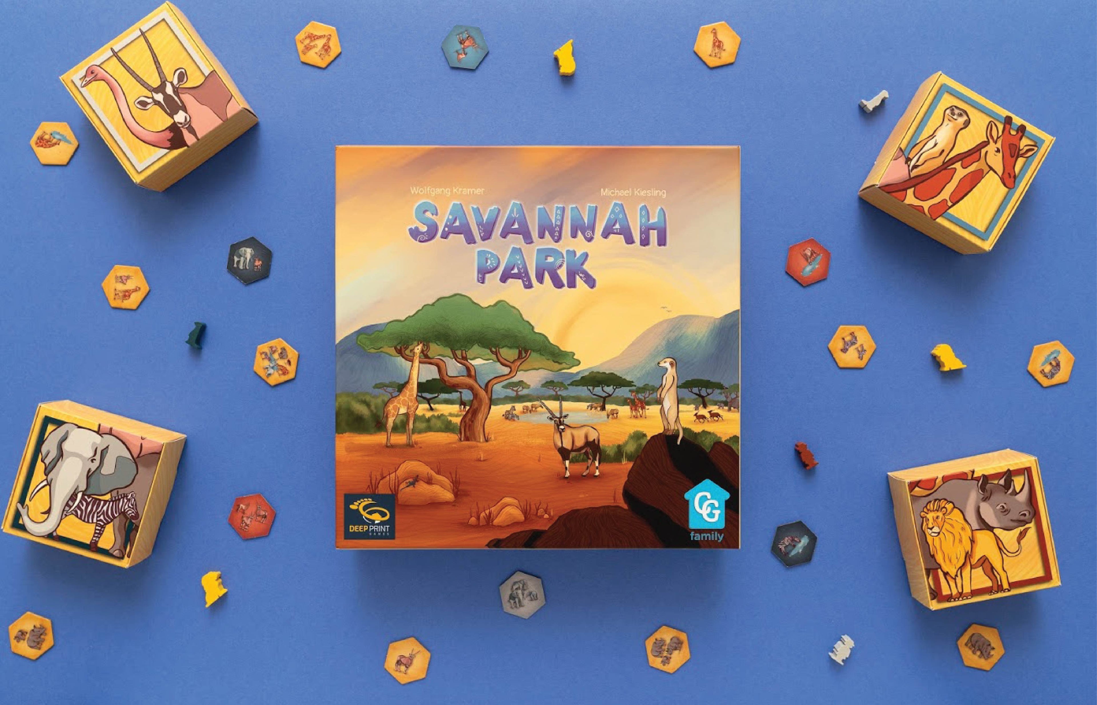 Savannah Park board game box front featuring illustrated African wildlife including giraffe, oryx, and meerkat, surrounded by colorful game components on a blue background.