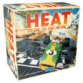 Front of Heat: Pedal to the Metal board game box by Days of Wonder, featuring retro Formula 1 racing car artwork.