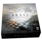 Front cover of Brass Birmingham board game box featuring moody cobblestone street artwork with designers Matt Tolman, Martin Wallace, and Gavan Brown credited.