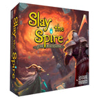 Front box art for Slay the Spire: The Board Game showing two armored characters amid swirling fire and flying cards before a dark spire.