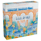 Railroad Tiles board game box featuring a watercolor illustration of a blue steam train crossing a brick viaduct above a colorful village.