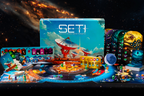 SETI board game box surrounded by its components including game boards, alien creature cards, player boards, meeples, tokens, and scoring tracks arranged on a starfield background.