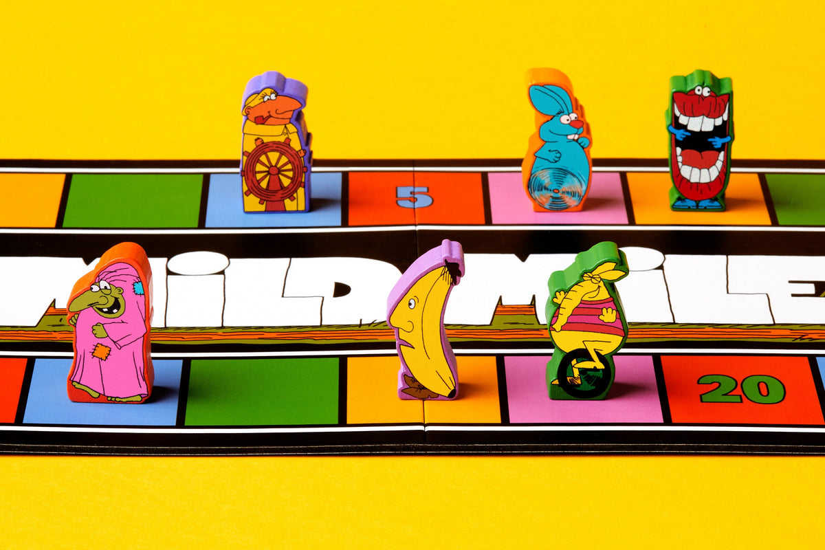 Five colorful wooden character meeples from Magical Athlete placed on a vibrant multicolored race track game board with numbered spaces.