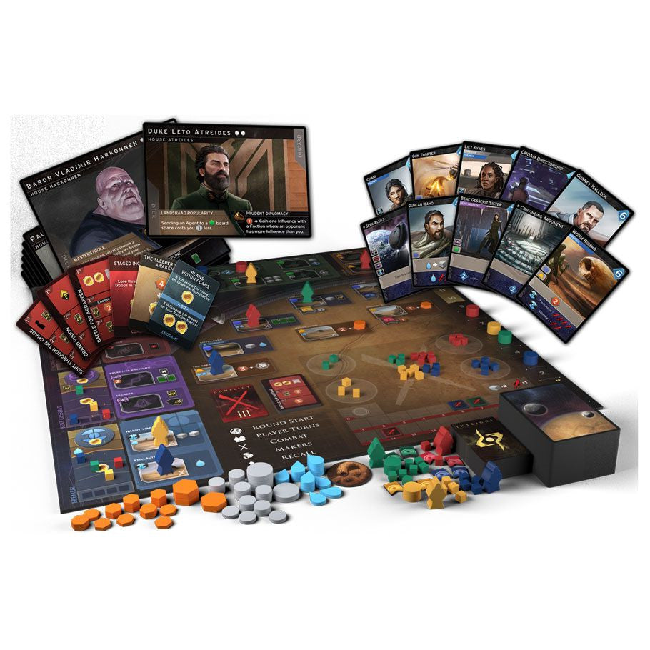 Dune: Imperium components spread showing game board, faction leader cards, ally cards, wooden meeples, tokens, and intrigue cards arranged for display.