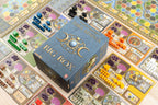 Terra Mystica Big Box edition displayed on a fully set-up game board surrounded by colorful wooden faction pieces and player boards.
