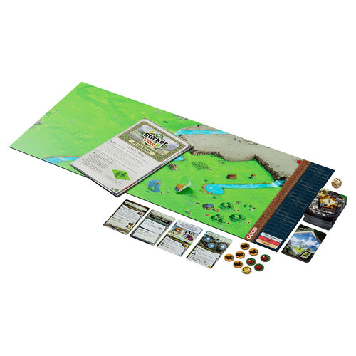 Cozy Stickerville board game spread showing green illustrated game board, storybook, cards, tokens, dice, and score track laid out on white background.