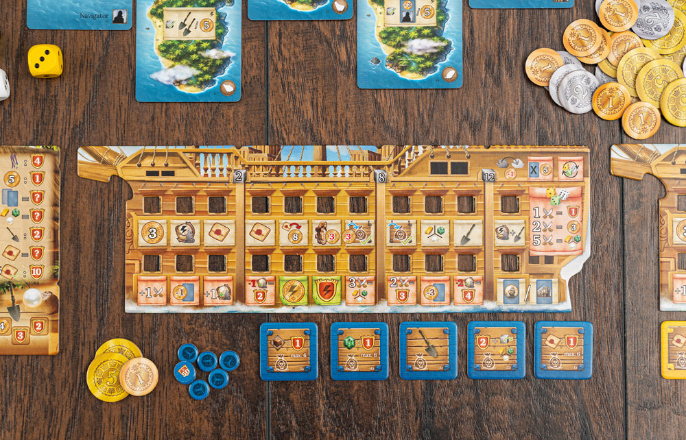 Pirates of Maracaibo game components spread on a wooden table showing a large ship board, island cards, gold and silver coins, blue player tokens, dice, and action tiles.