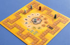 Savannah Park game board with numbered scoring track, central animal hexagon tiles, and four colored wooden meeples positioned around the safari-themed board.