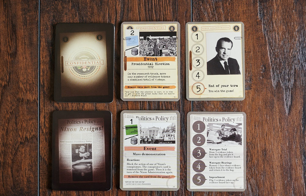 Six Watergate board game cards spread on a wooden surface, including Confidential, Event, Nixon Administration, and Politics & Policy cards.